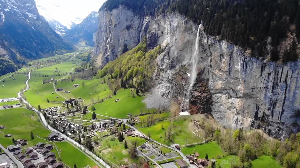 Aerial Footage Of A Village Built In A Valley Between Mountains