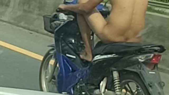 Undressed Man on a Motorcycle