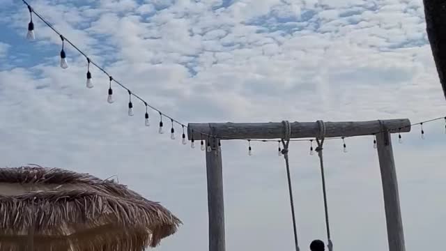 Seesaw riding in front of the Korean beach