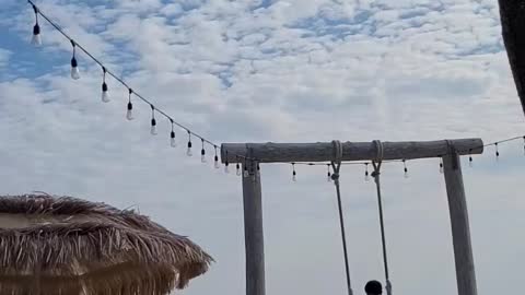 Seesaw riding in front of the Korean beach