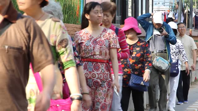 Tourists and Thais walking