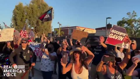 Thousands BOOING Biden as he rides into California