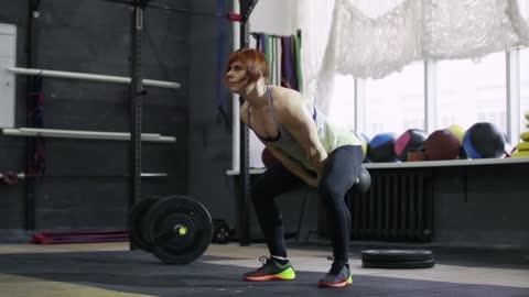 Girl doing kettlebell swing