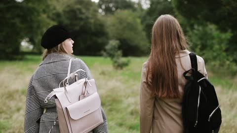 Girls Walking In Forest