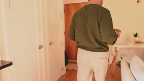 A Man Serving Sandwiches
