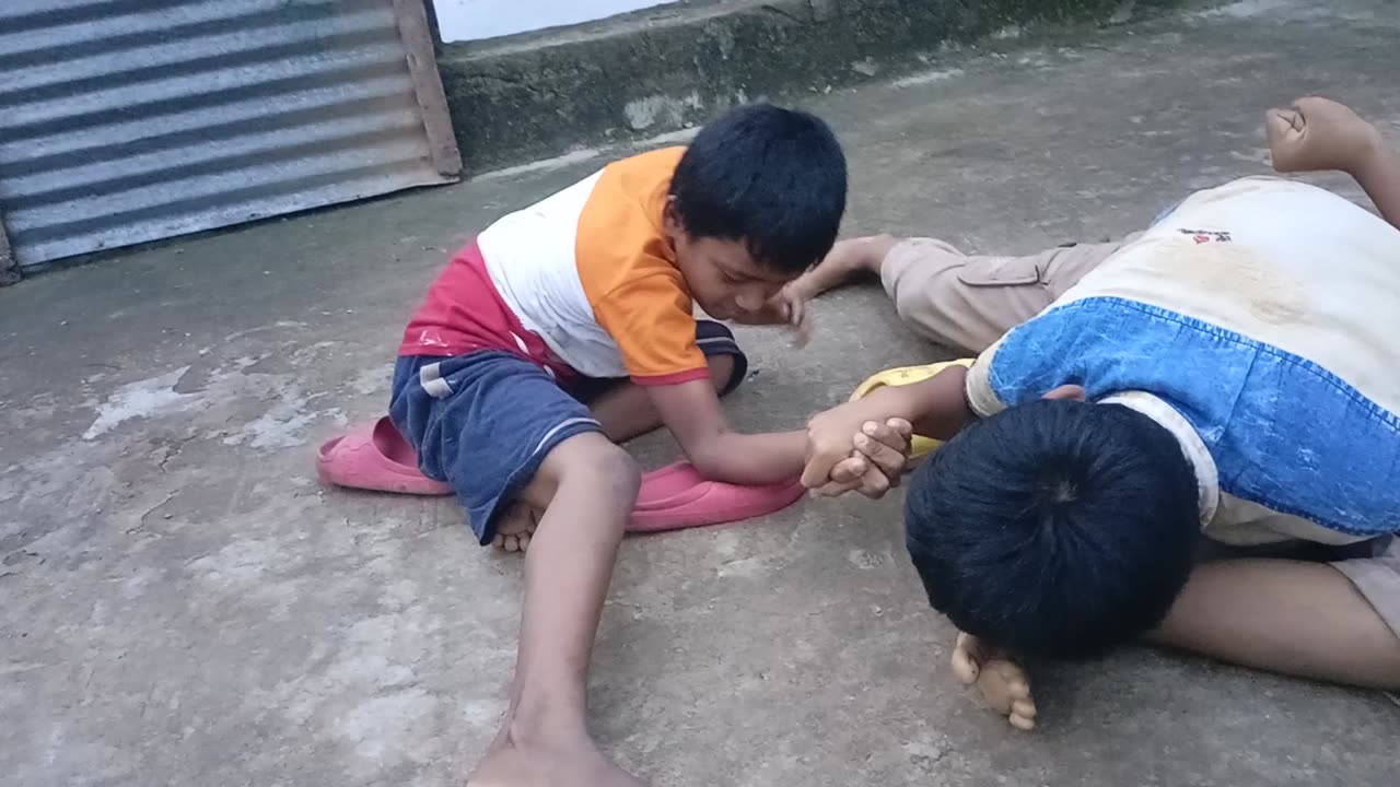 Two children fight.