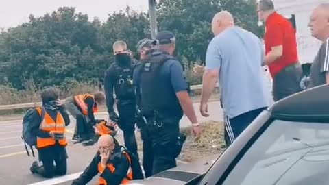 Why are these cops protecting climate activists?