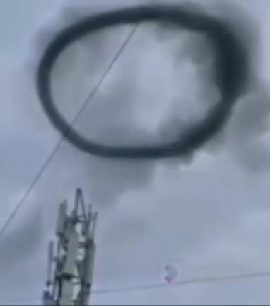 A strangely shaped circular mass formed at the top of the 5G tower.