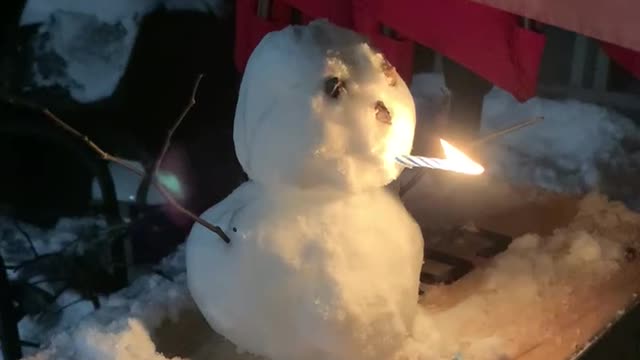 Snowman smoking candle