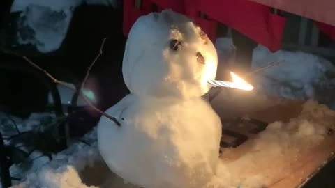 Snowman smoking candle