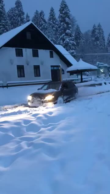 Audi a4 b7 quattro against big snowdrifts. German bulldozer