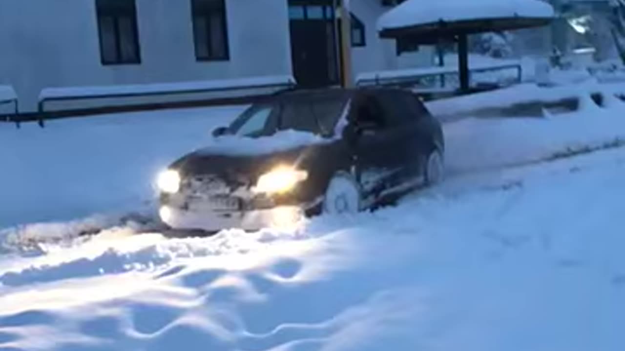 Audi a4 b7 quattro against big snowdrifts. German bulldozer