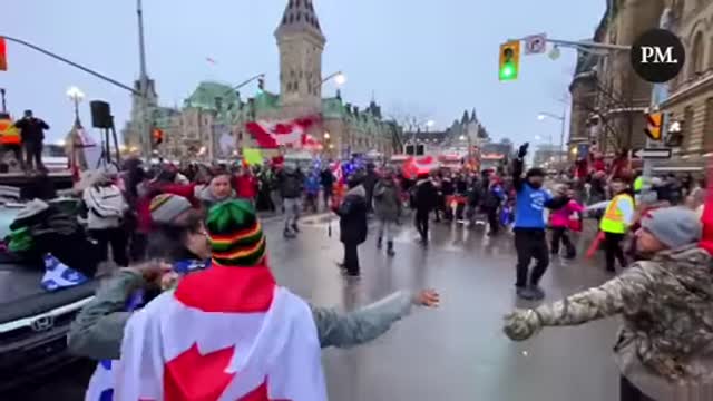 THE RALLY OF CANADIAN MADATE VACCINE TURN SINGING WE ARE THE WORLD.