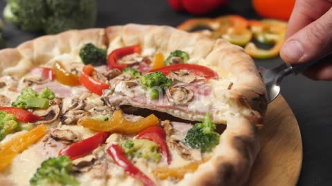 A Male Hand Raises a Slice of Pizza on a Cake Spatula