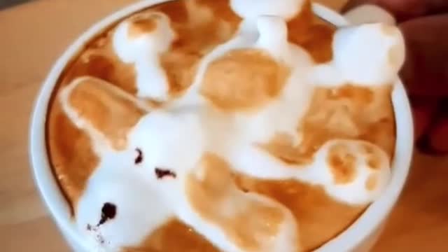 A Cup of coffee with a puppy image of foam on top