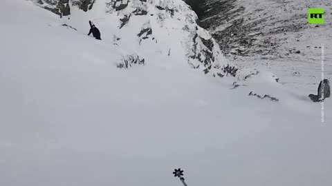 Moment skier triggers avalanche