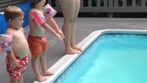 Child Does a Spectacular Belly-Flop into the Pool