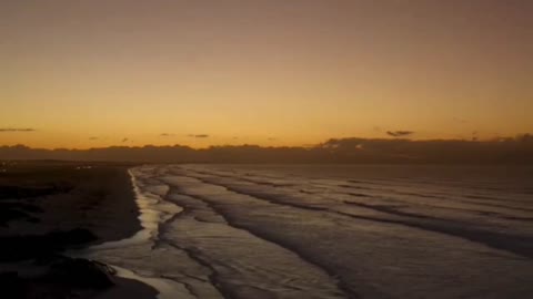 The setting sun was like blood. The sun shone its last light on the beach