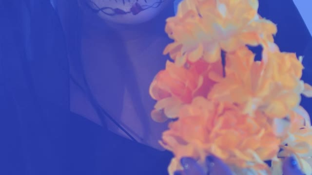 Catrina girl with a bouquet of marigold flowers