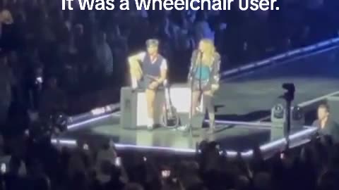 Madonna calls out concertgoer for sitting down before realizing fan was in wheelchair