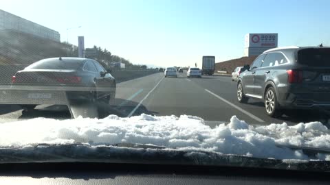 In a car driving on the Korean highway