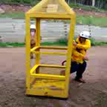 Working on cell tower from man basket