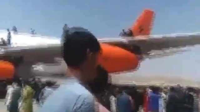Afghans still climbing on aircraft at Kabul airport knowing it's almost certain instant death.