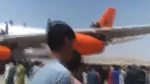 Afghans still climbing on aircraft at Kabul airport knowing it's almost certain instant death.