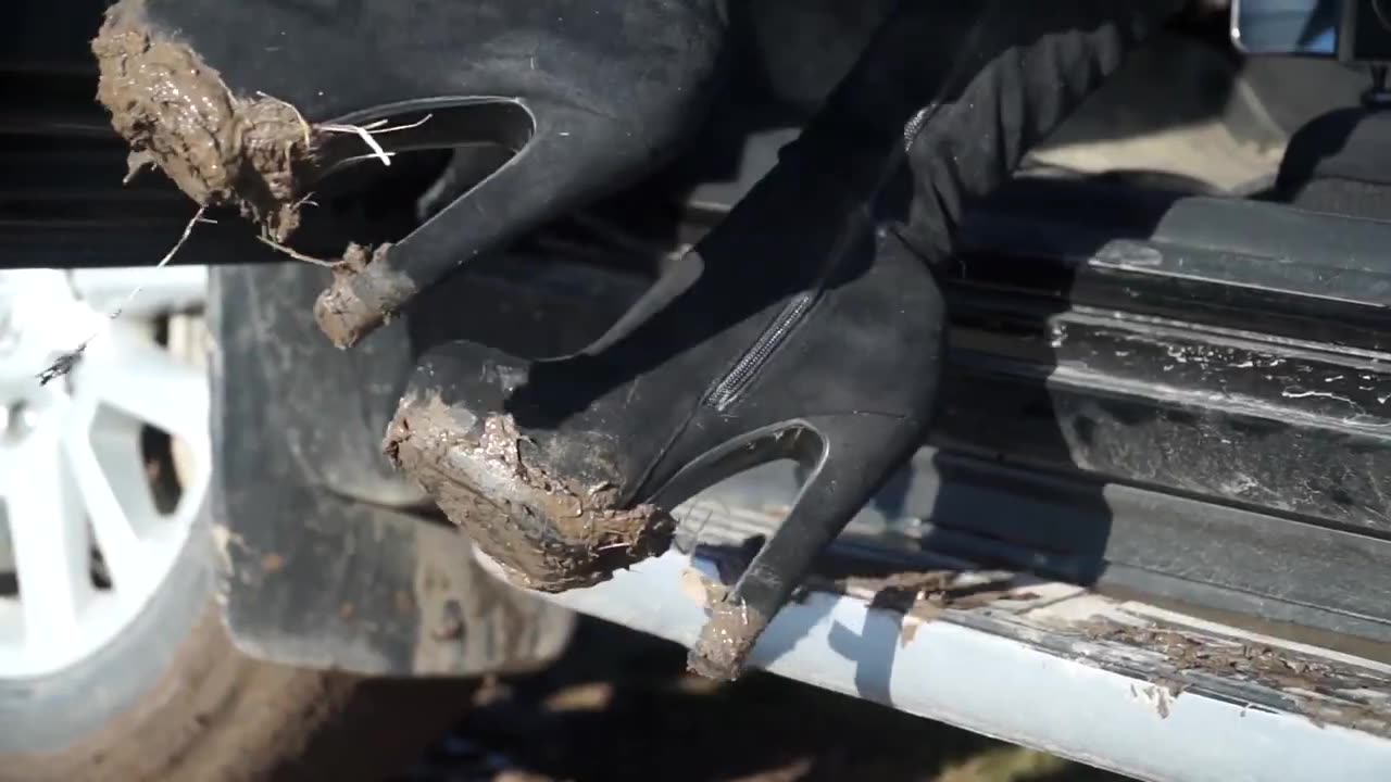 Girl driving a Toyota Land Cruiser Stuck in the mud