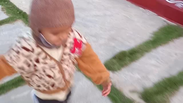 Amazing Kid walking in the park