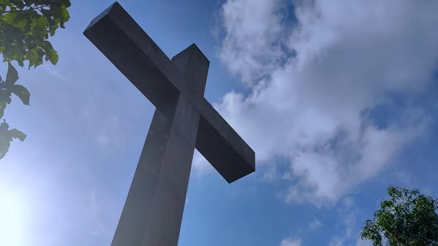 TIMELAPSE OF CROSS AND BULE SKY