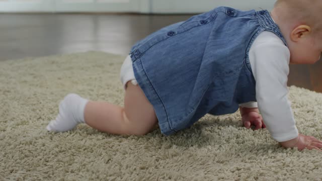 Baby crawling on the floor