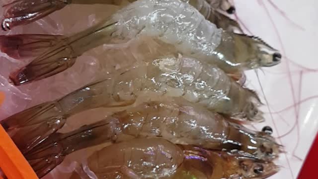Prawn alive despite raw fish.