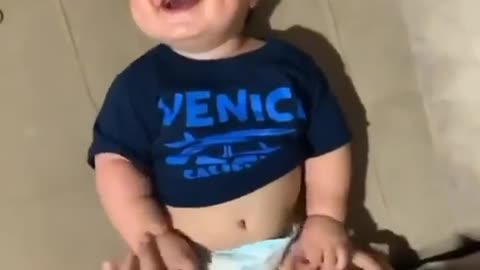 Baby Laughing And Playing With Dad