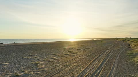 Slow moving drone over the beach