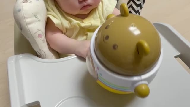 Baby playing with a wobble toy