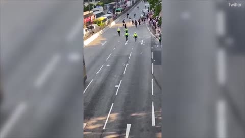 Hong Kong motorcycle cop aggressively charging protesters