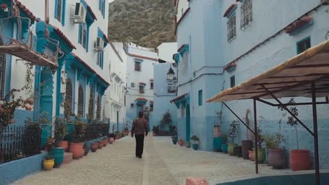 A Man Walking On A Narrow Road