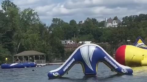 Girl Catches Massive Air from Fat Boy Float at Water Park