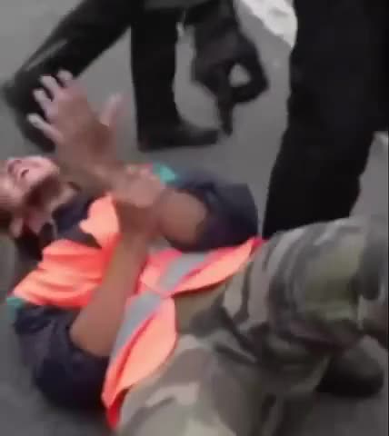 Police ripped their glued hands from the street!