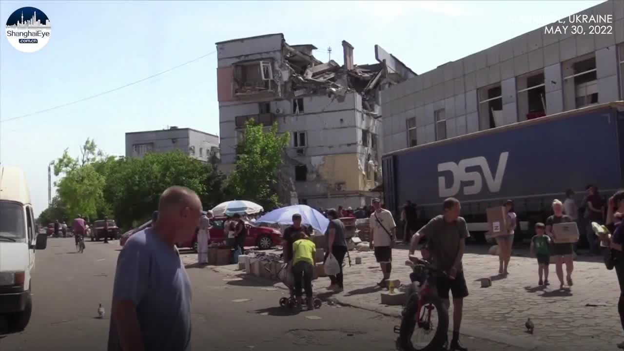 Residents in Mariupol queue for humanitarian aids as Russia pledges to rebuild the Ukrainian city