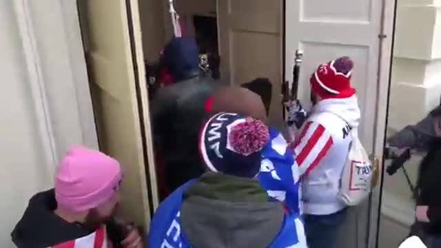 Language Warning: Capitol Police open the doors to the U.S. Capitol for the protestors.