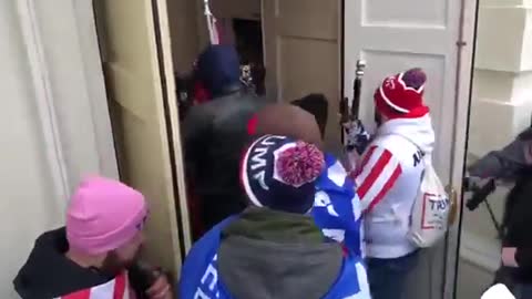 Language Warning: Capitol Police open the doors to the U.S. Capitol for the protestors.