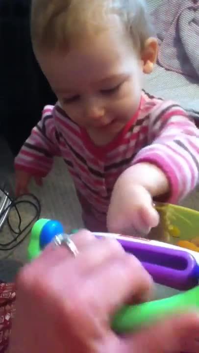 Emma playing baby