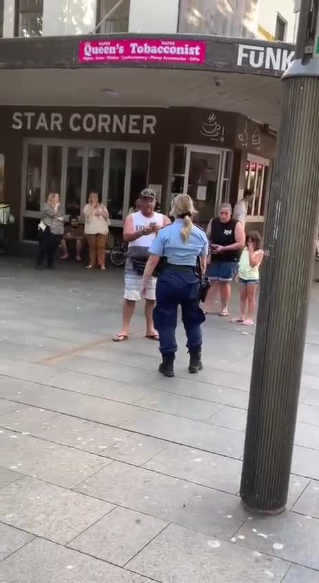 Sydney Australia Police officer swears Infront of a man's child and then pepper spray him
