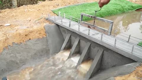 Construction Of A Small Dam With Three Blow Down Gates