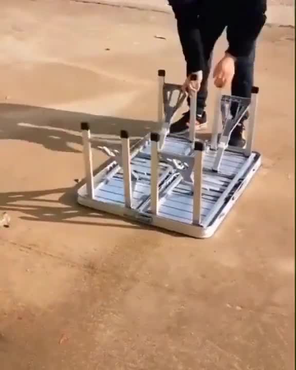 Check out this table that folds up into a suitcase