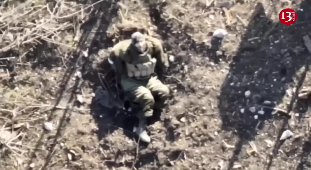 Scared to death, Russian soldier watches the drone flying over