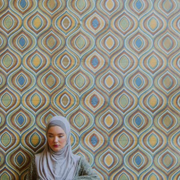 A Woman Holding a Mirror with a Message in it