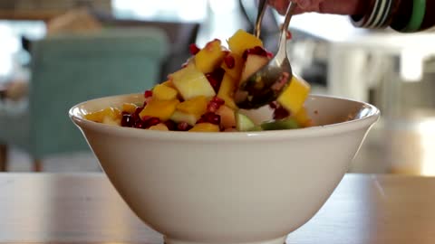 Mixing Fruit On A Bowl